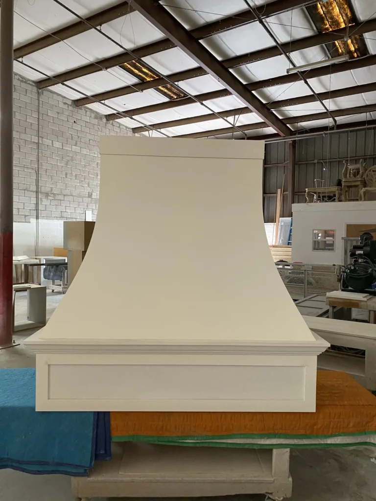 Custom white range hood fabricated in the JR Custom Cabinetry workshop