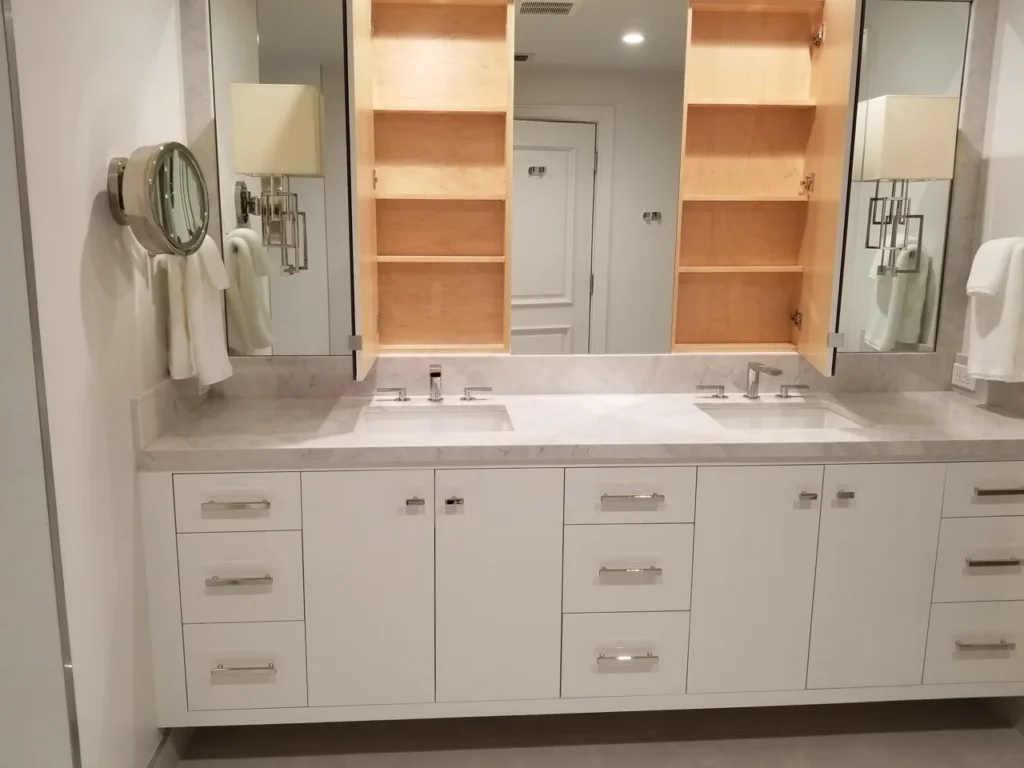 Modern white floating double vanity with mirrored storage and warm wood interiors